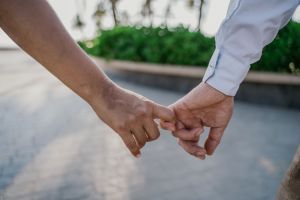 two people holding hands